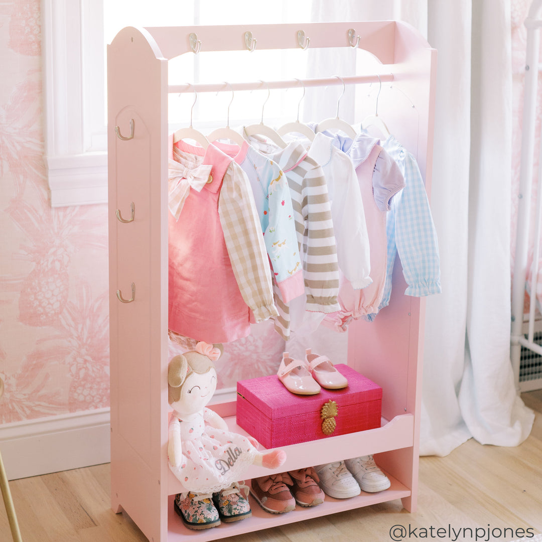 A rainbow themed bookshelf features 3 tiers, hidden storage and a side shelf