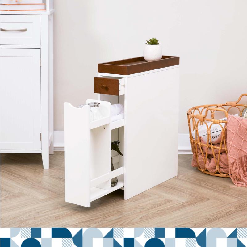 A tall and thin, free-standing cabinet features drawers sits in a white room next to a clothes basket.