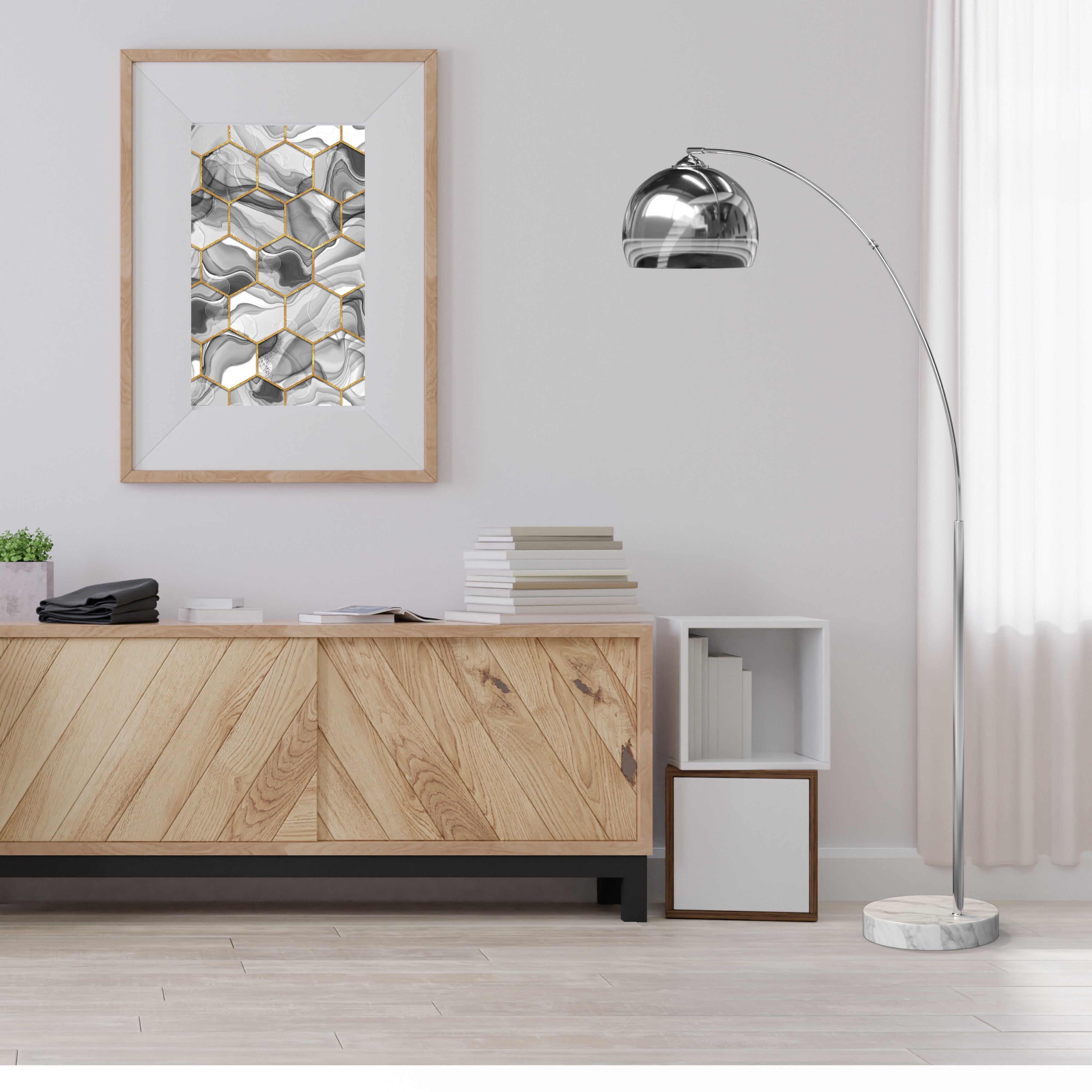 A modern living room with a white chair, wooden cabinet, and a silver arc floor lamp.