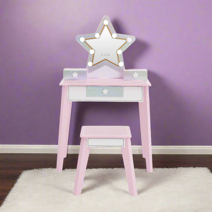 a star shaped vanity in pink and glittery silver with led lights is shown in a girls bedroom