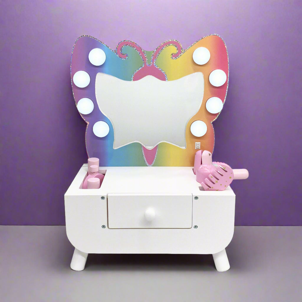 Butterfly vanity with makeup sitting on a desk in a purple room.