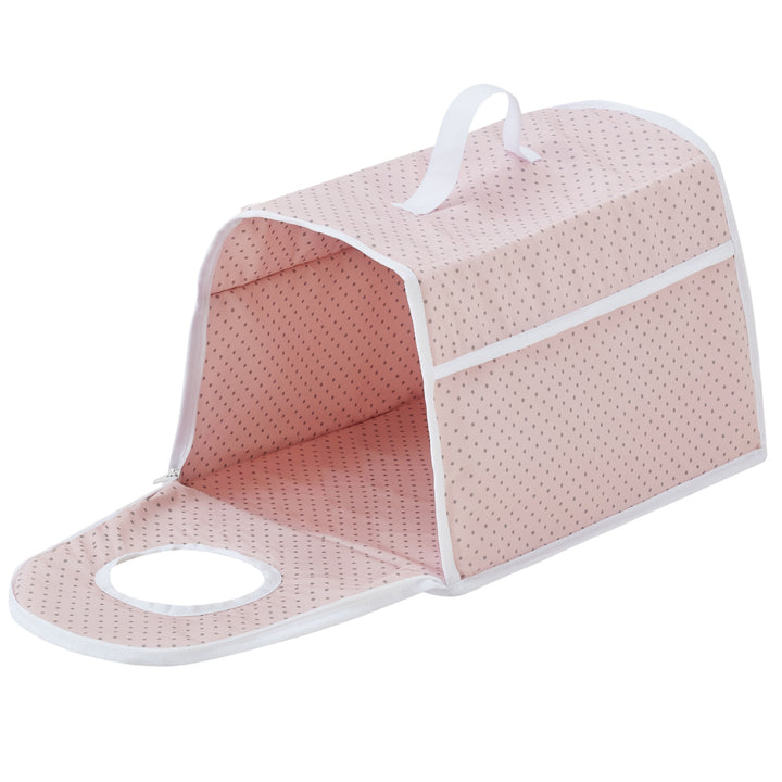 A pink and white polka-dotted fabric pet carrier with a handle, side zipper, and circular viewing hole. The carrier is unzipped and open.
