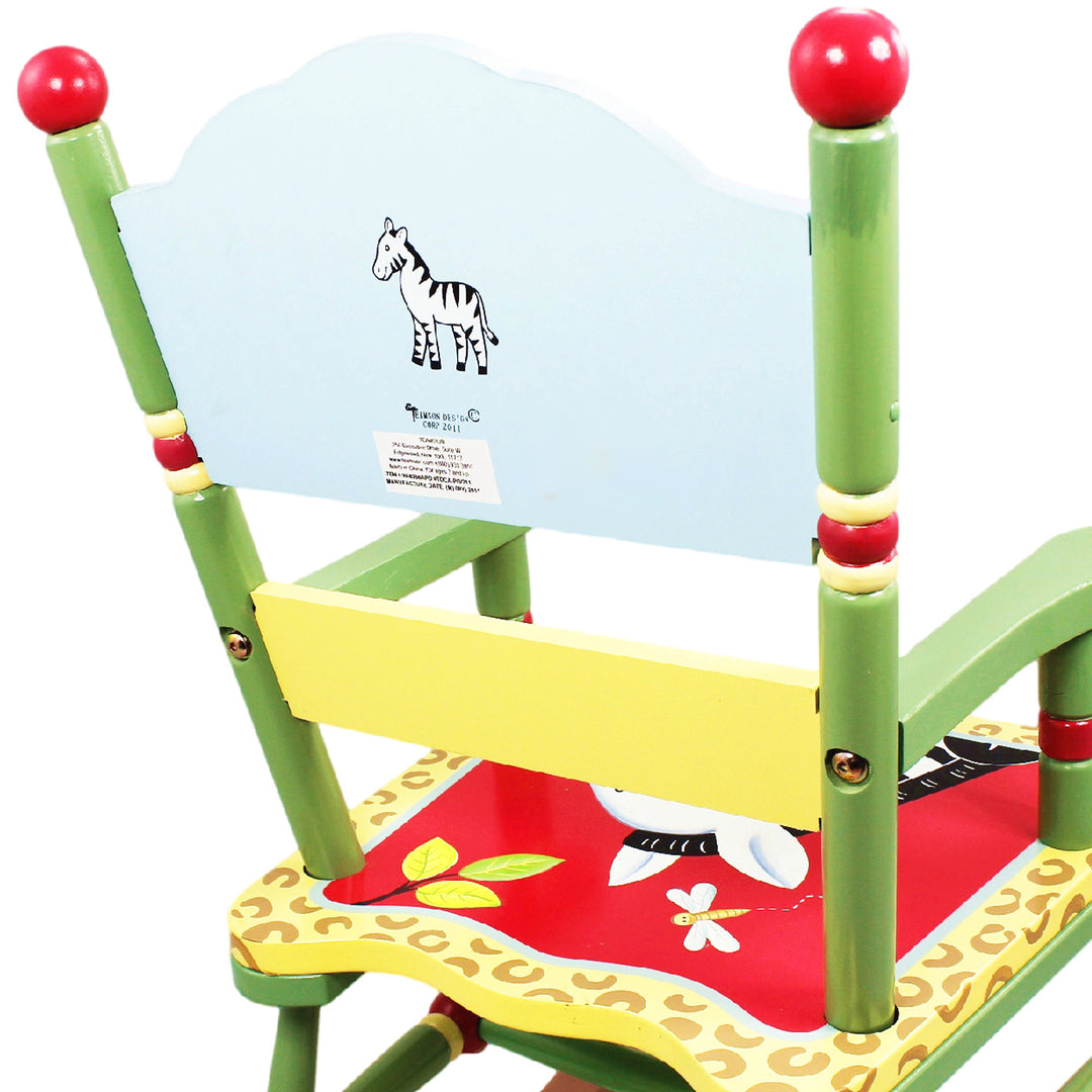 Close-up of the back of the rocking chair with a zebra in the middle.