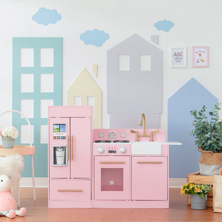 A modern pink play kitchen in a stylish playroom