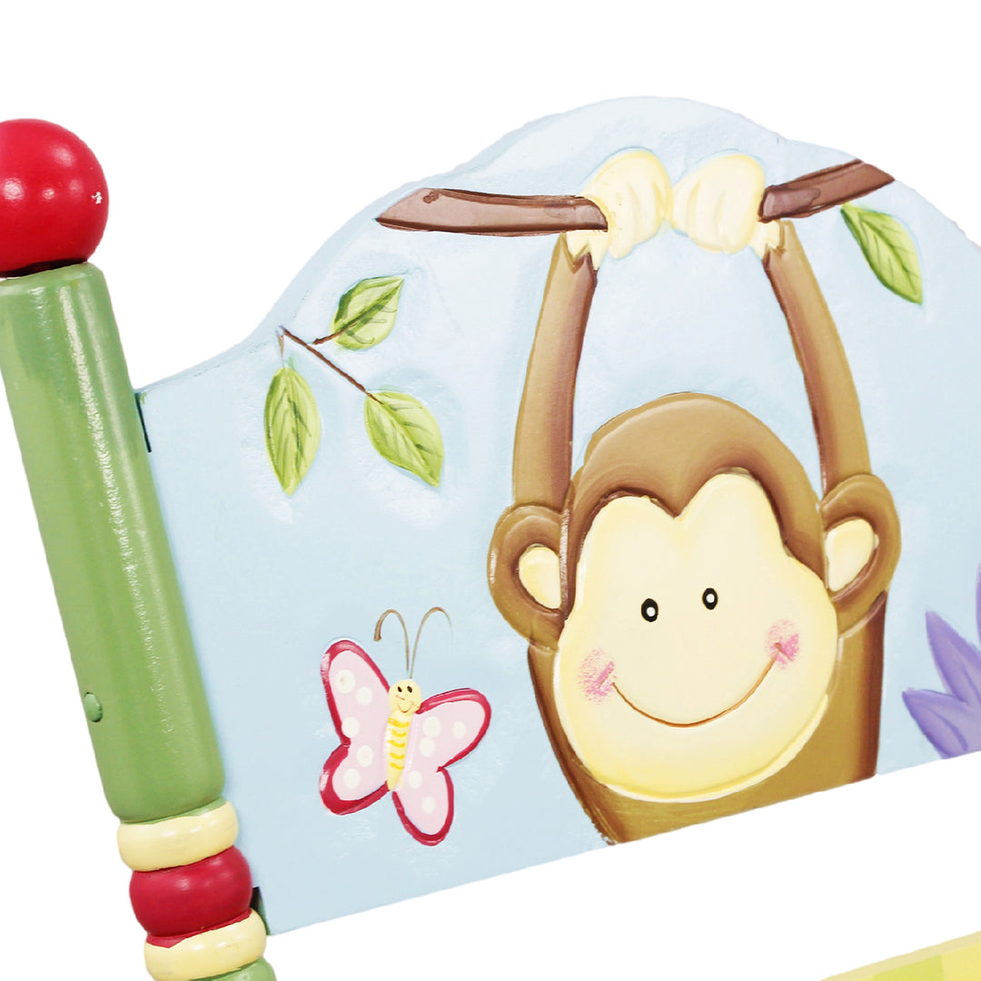 A monkey hanging from a branch on a Fantasy Fields - Sunny Safari Rocking Chair, Multicolor.