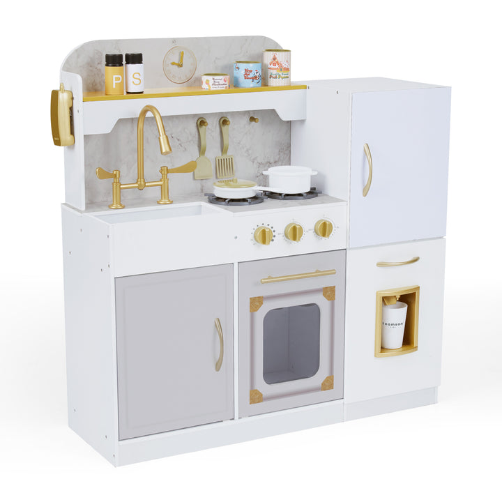 A white play kitchen with gold hardware