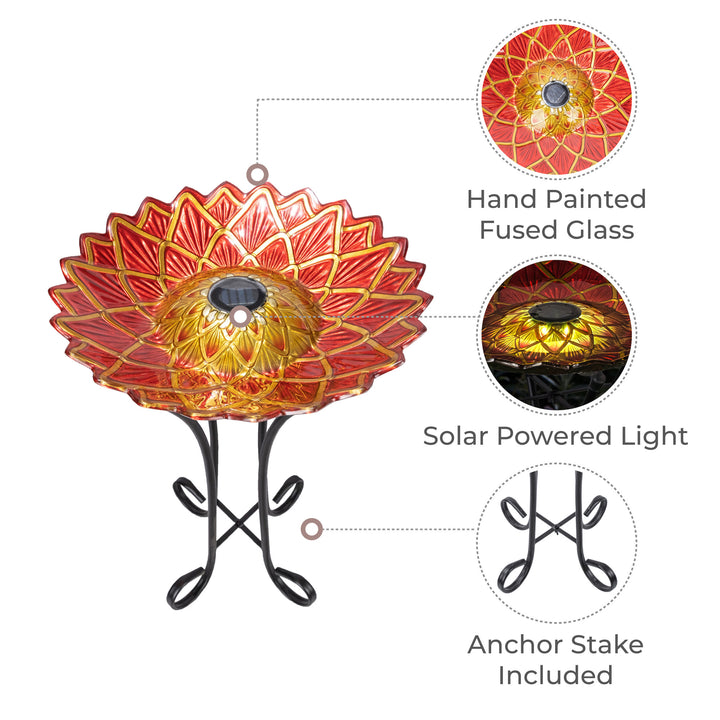 Callouts of features including a hand-painted red and gold fused glass bowl, solar-powered light, and a foldable metal stand with anchor stake