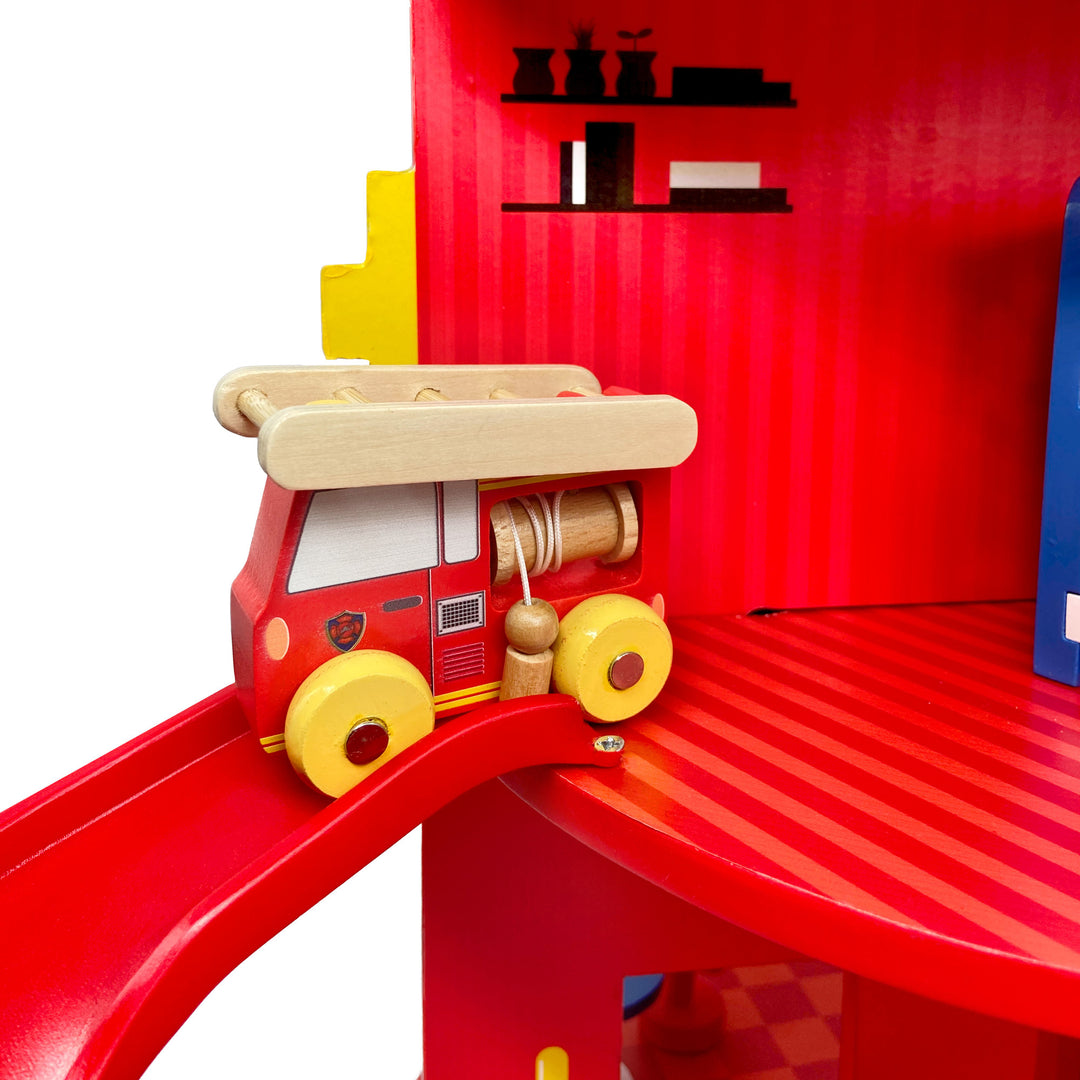 Close up image of the firetruck going down the slide.