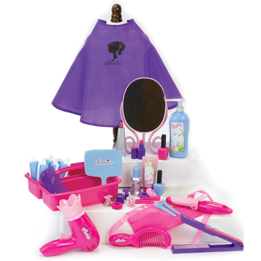 A table with a variety of toys, including Sophia's Hair Salon Complete 30 Piece Play Set for 18" Dolls for pretend play hair stylist activities.