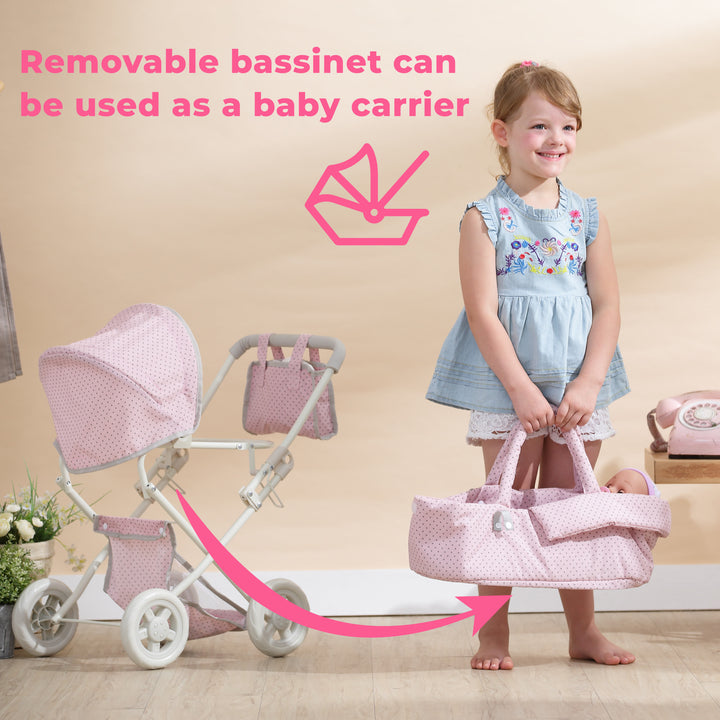 A girl is standing next to Olivia's Little World Polka Dots Princess Deluxe Baby Doll Stroller, Pink with the words removable bassinet can be used as a baby doll carrier.
