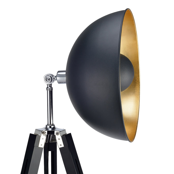 A versatile Teamson Home Fascino Tripod Floor Lamp with a large black reflector and a golden interior on an industrial floor lamp stand against a white background.