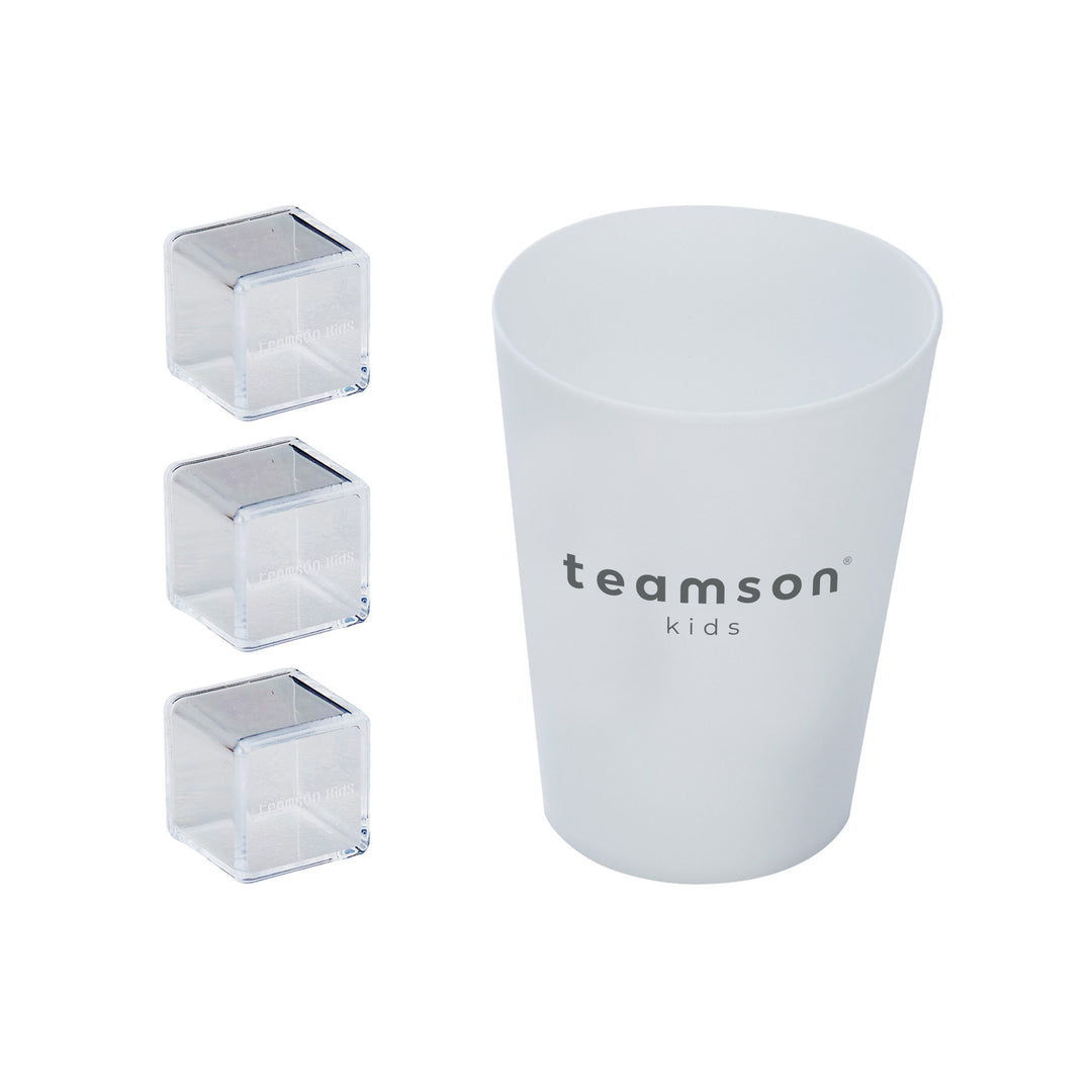 A white cup with "Teamson Kids Little Chef Westchester Retro Play Kitchen, Pink" printed on it, accompanied by three clear acrylic blocks nearby, part of a Kids play kitchen set.