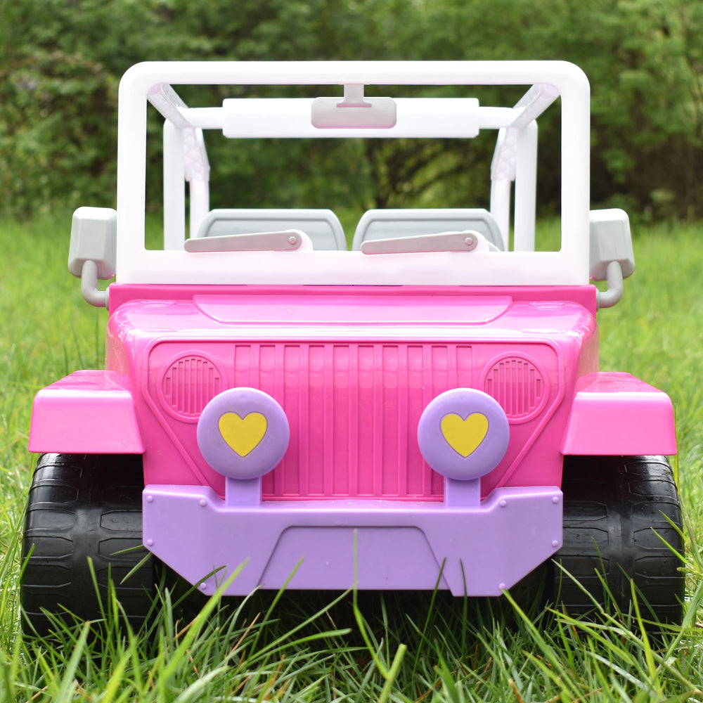 Sophia's 4 x 4 Hot Pink Beach Cruiser Truck for 18" Dolls is parked in the grass.