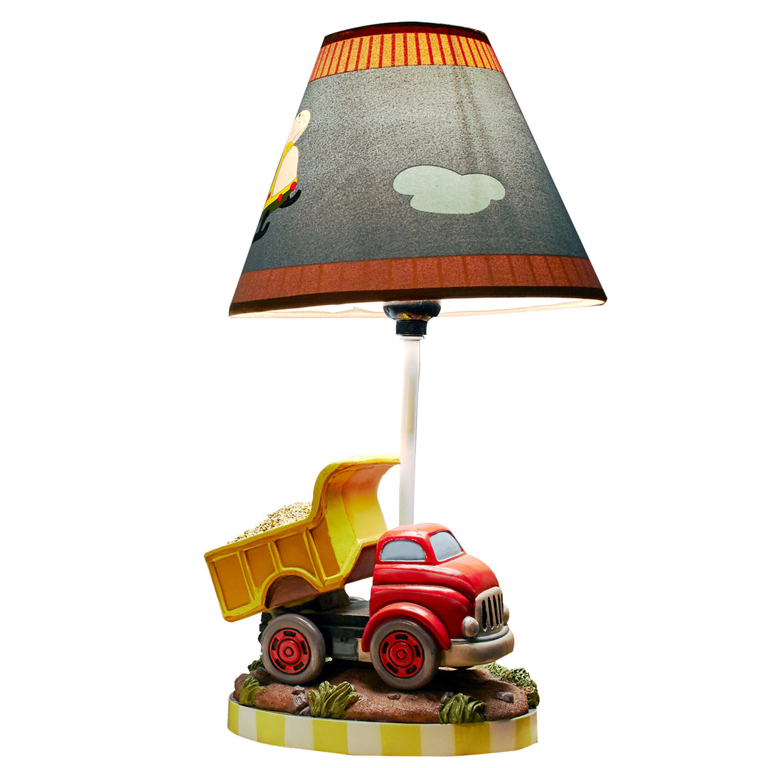 A table lamp with a helicopter on the shade and a red and yellow dump truck on the base of the lamp.