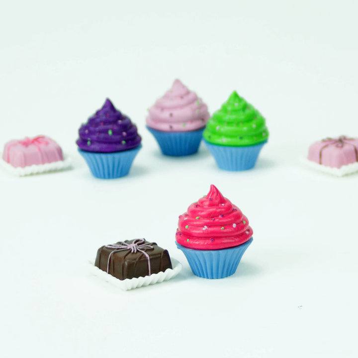 A group of Sophia's Cupcakes & Petit Fours Dessert Set for 18" Dolls and a chocolate.