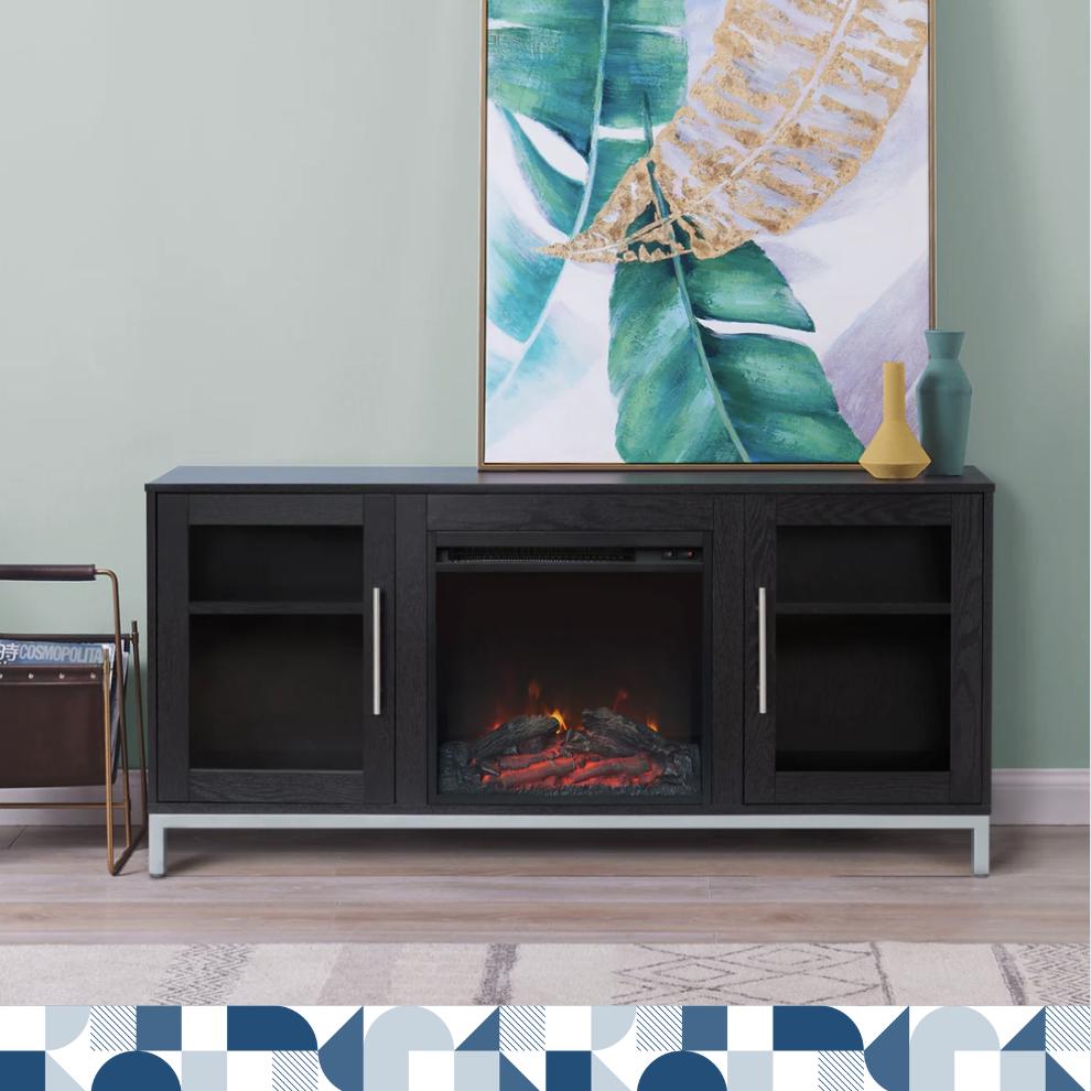 A black wood grain entertainment center with an electric fireplace against a mint green wall with a painting on top.