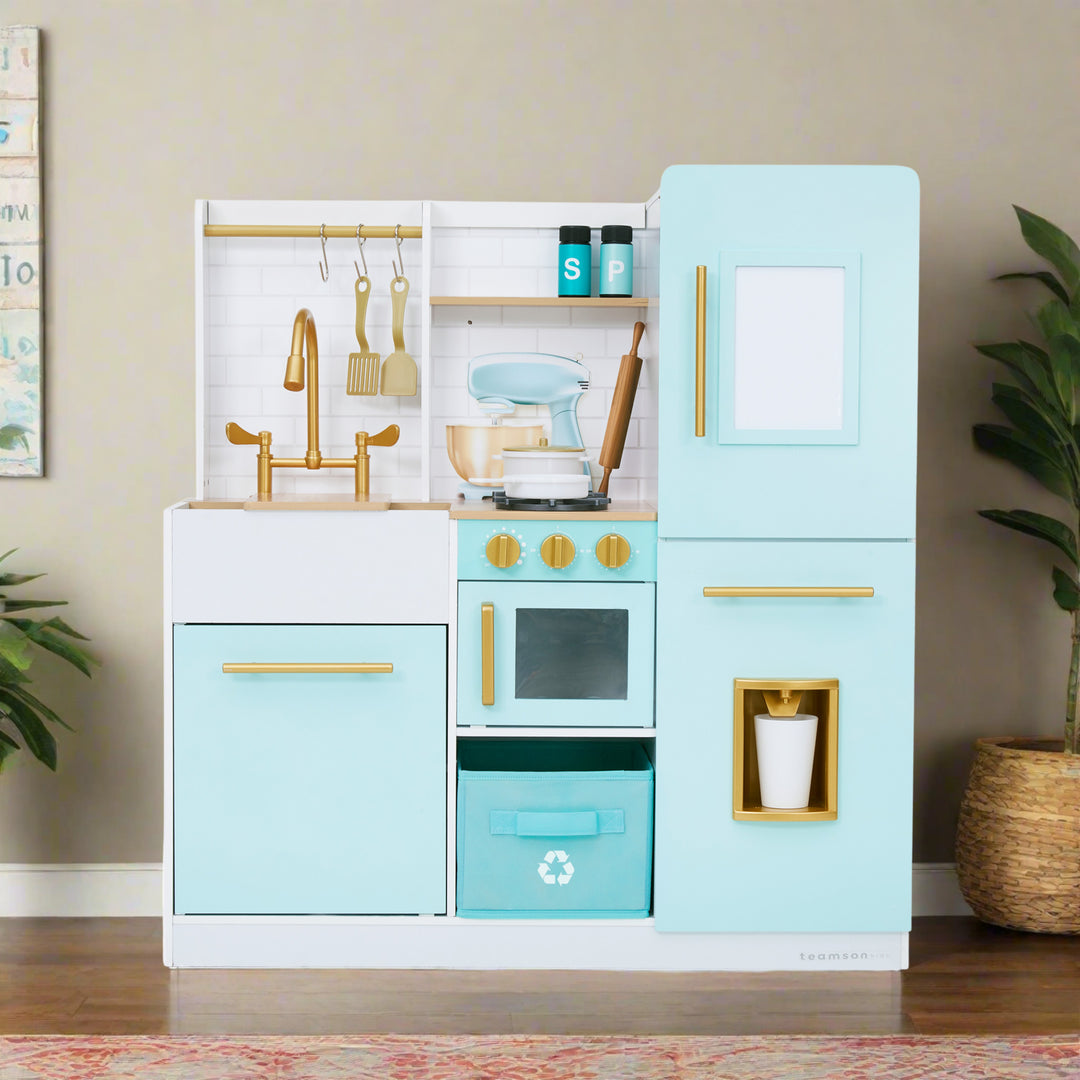 A blue play kitchen with beautiful gold hardware and realistic effects is displayed in a children's play room