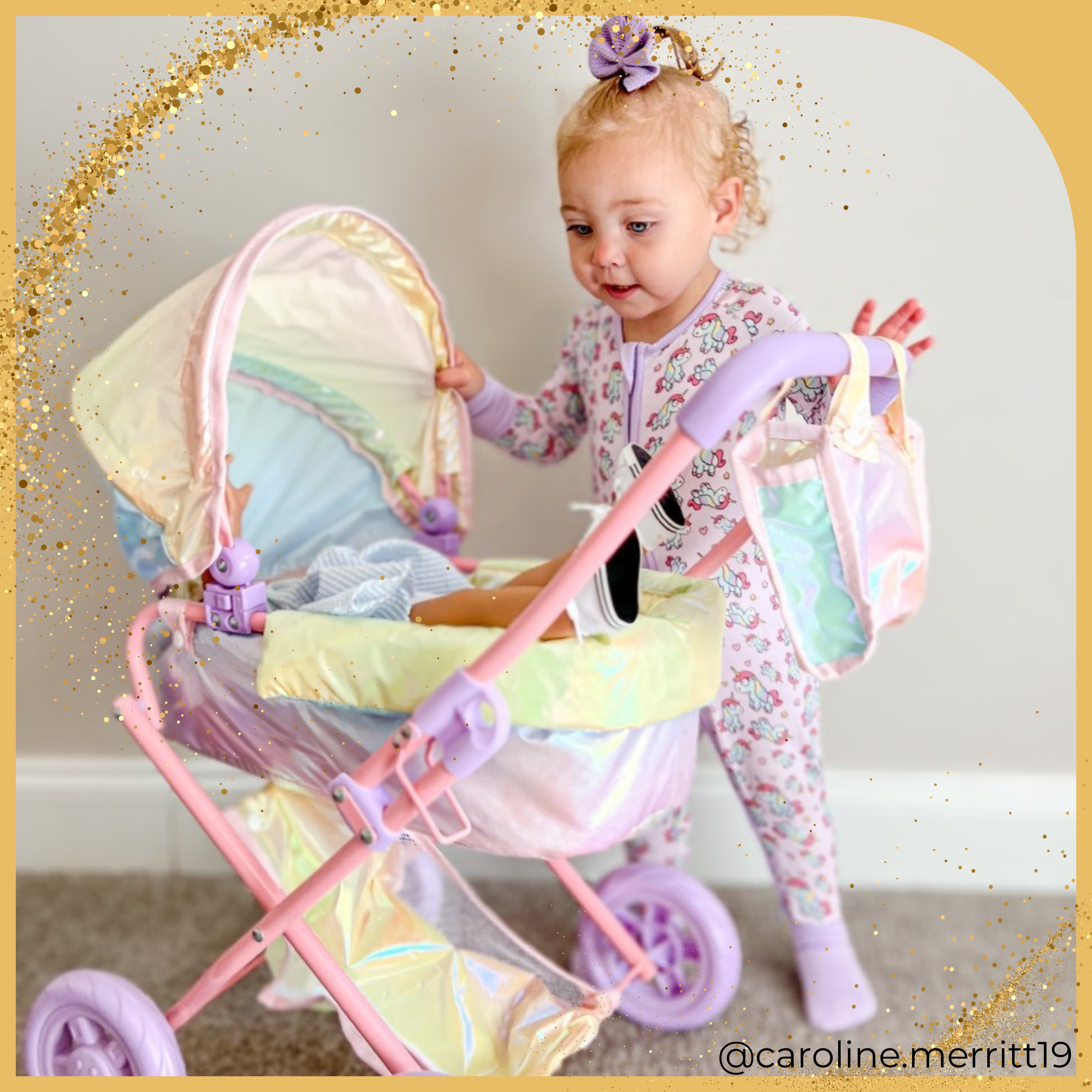 a young girl peeks in on her baby sleeping in the child sized stroller