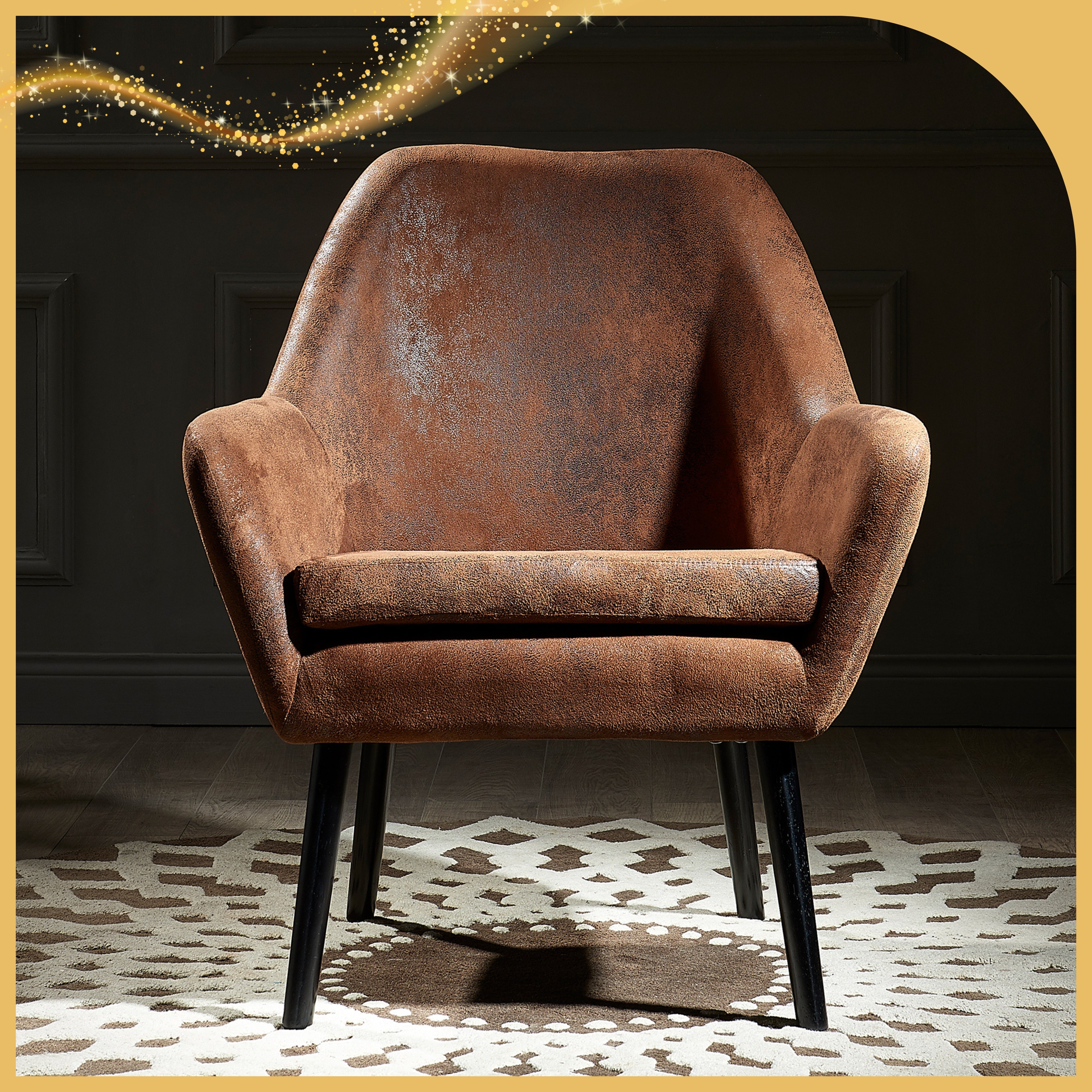 a brown fabric chair sits in the spotlight welcoming a guest with arms open