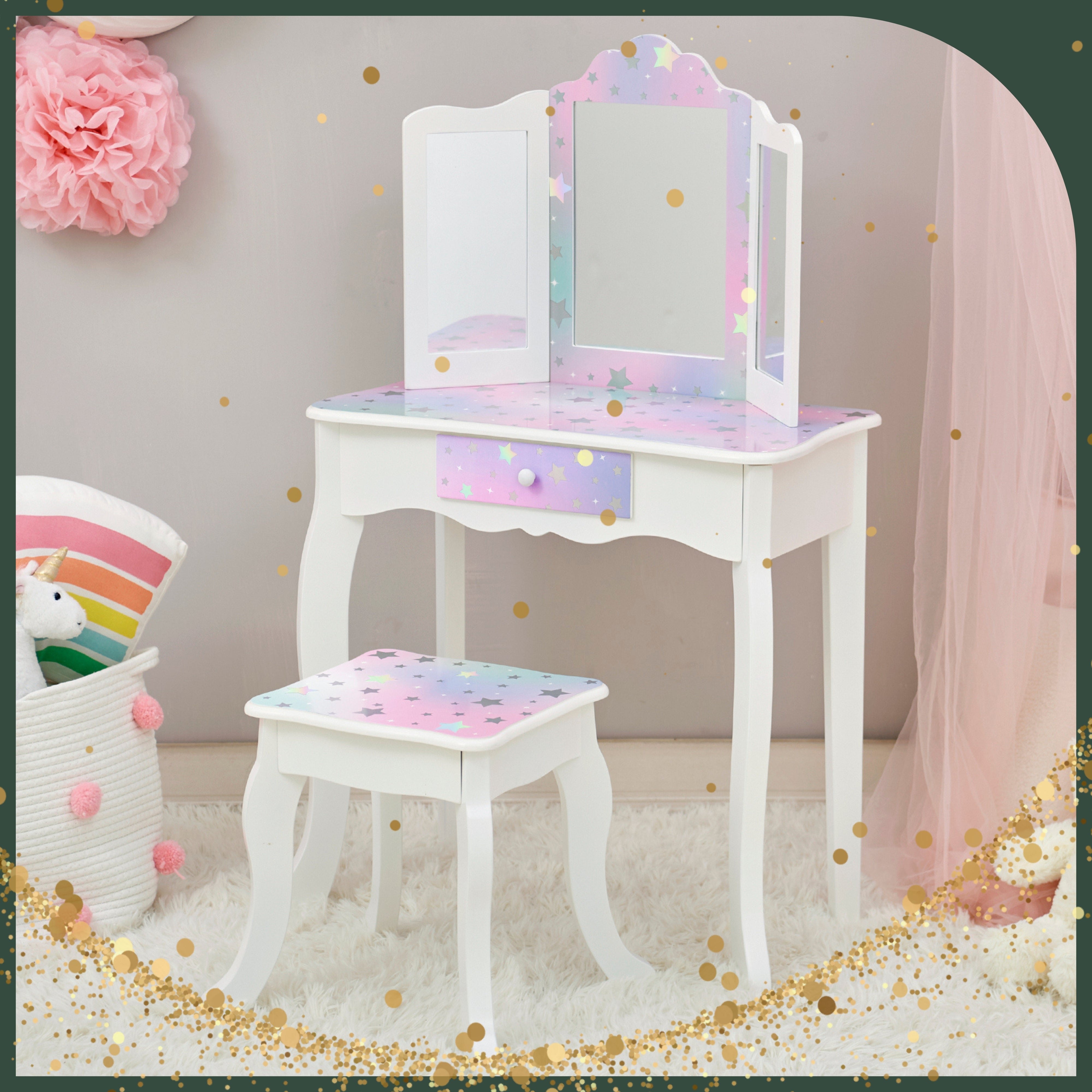 this white and purple vanity with stars sits in a little girls bedroom