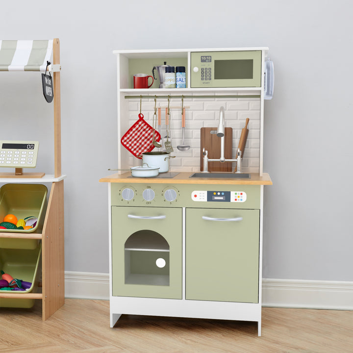 A Teamson Kids Little Chef Boston Modern Wooden Kitchen Playset equipped with a microwave, stove, oven, sink, assorted play utensils, dishes, and interactive features.