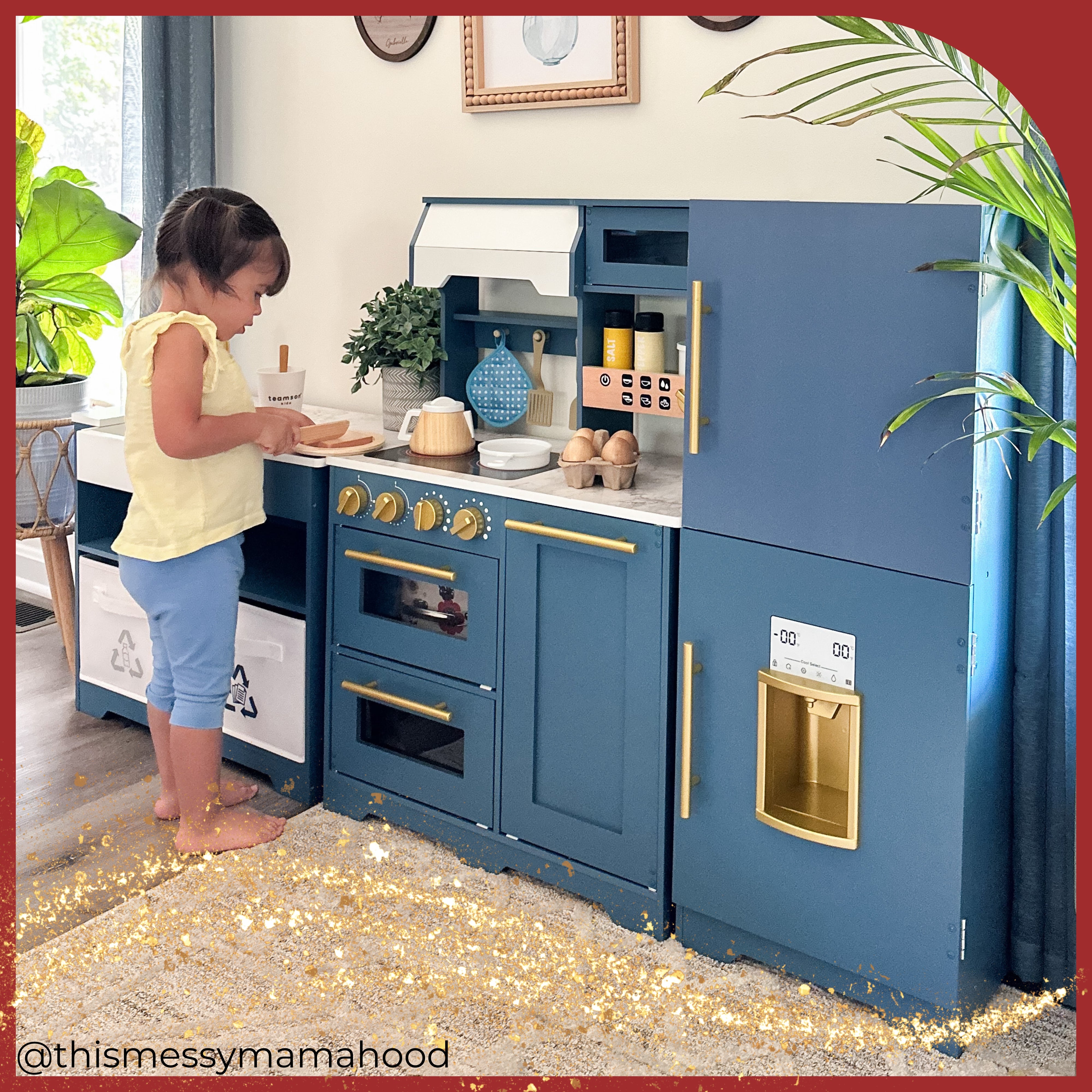 a young girl cooks in front of her three piece play kitchen in a beautiful living room