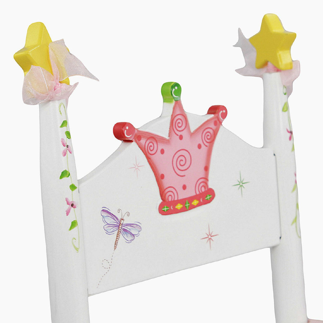 A Fantasy Fields Princess and Frog rocking chair with a crown and stars on it.