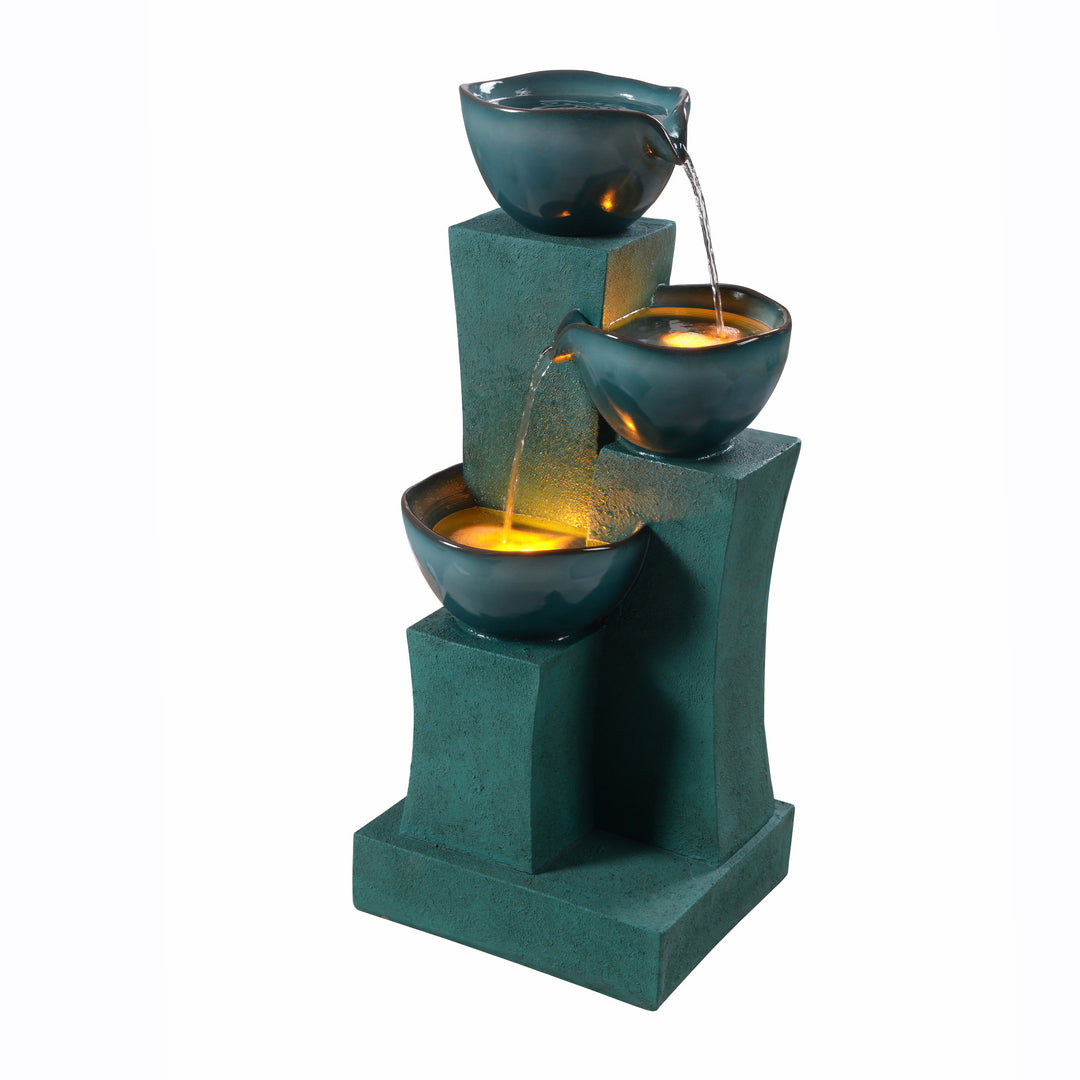 An indoor 28.54" 3-Tier Water Fountain with LED Lights, Green on a stepped structure.