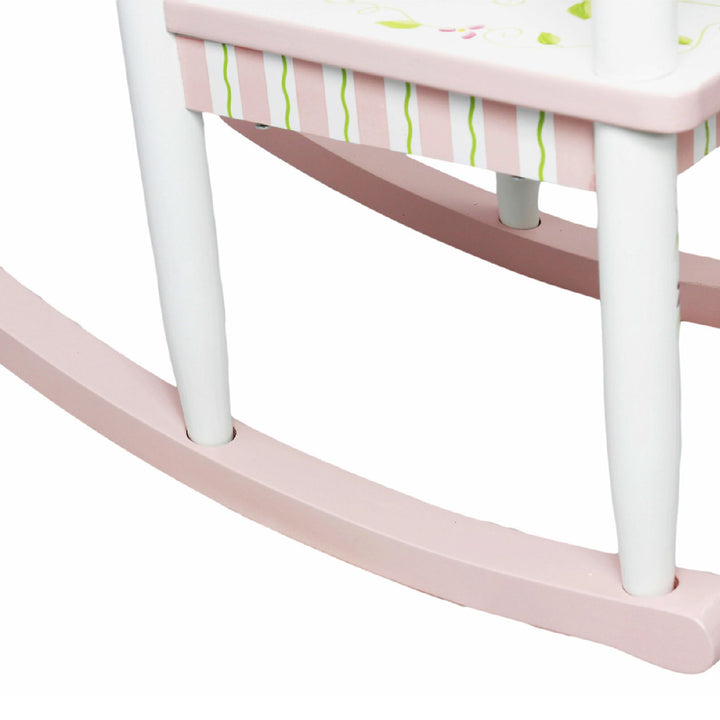 A Fantasy Fields Princess and Frog rocking chair with white/pink trim.