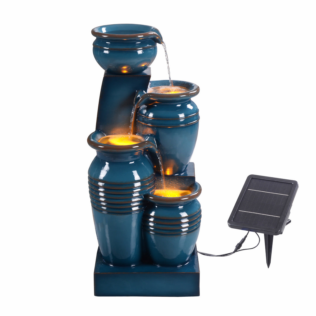 Teamson Home 28.74" Blue 4-Tier Outdoor Solar Water Fountain with LED Lights illuminated underneath flowing water