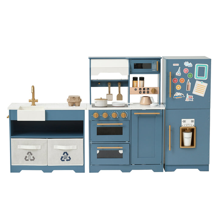 A TEAMSON KIDS - LITTLE CHEF ATLANTA LARGE MODULAR PLAY KITCHEN, STONE BLUE/GOLD with blue cabinets and a refrigerator.