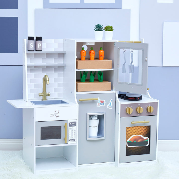 A Teamson Kids Little Chef Lyon Complete Wooden Kitchen Set with Hydroponic Garden, Refrigerator and Accessories, Gray in a room with wall art and a LED grow light.