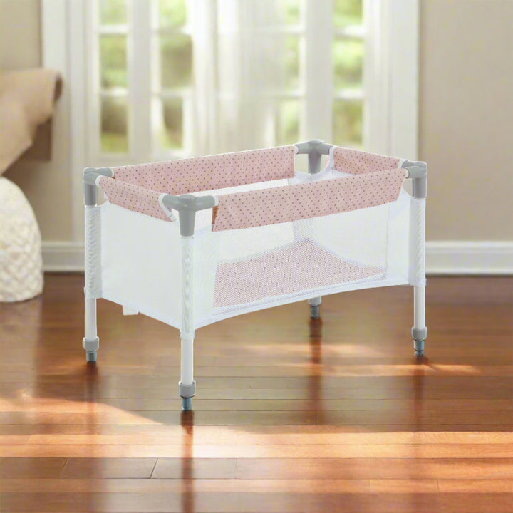 baby doll pack n play in a living room