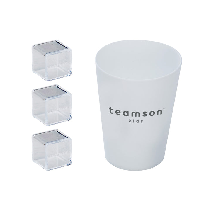 A white cup with "Teamson Kids Little Chef Charlotte Modern Play Kitchen, Silver Gray/Gold" printed on it, accompanied by three clear, square ice cubes displayed in front of it as part of a kids kitchen playset on a white background.