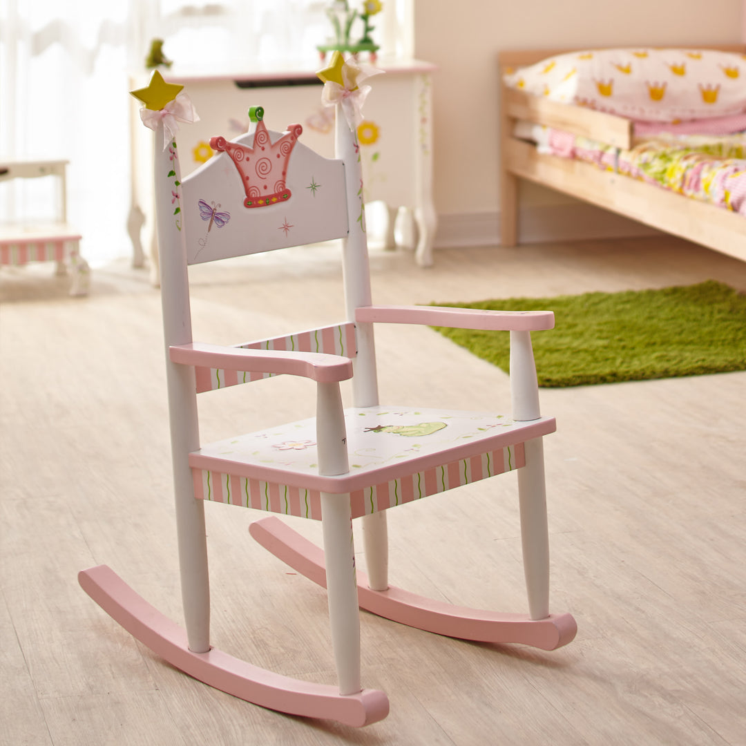 A white and pink rocking chair with a pink crown, yellow stars and floral accents.