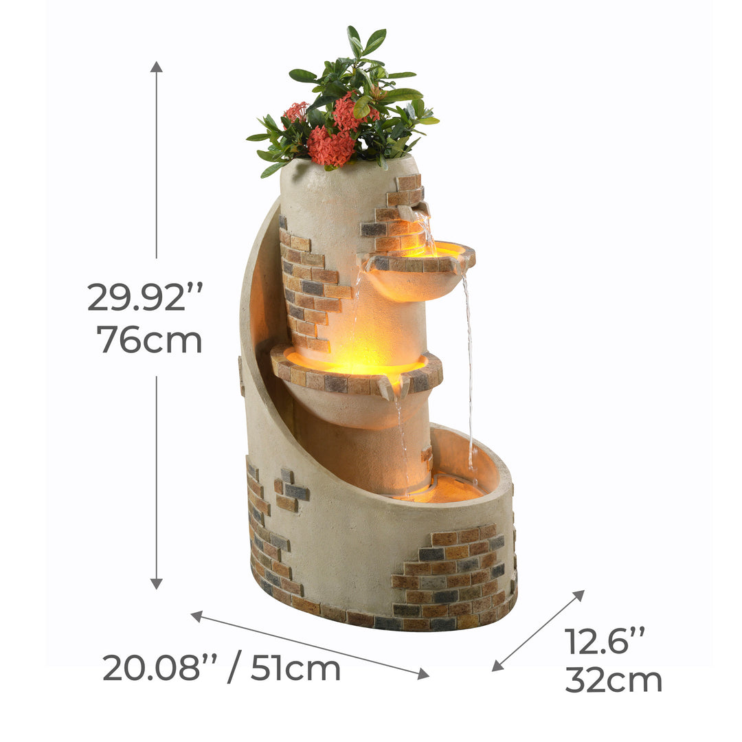 29.92" Outdoor Water Fountain with Planter & LED Lights, Ivory with warm lighting and artificial plants, accompanied by measurements in inches and centimeters