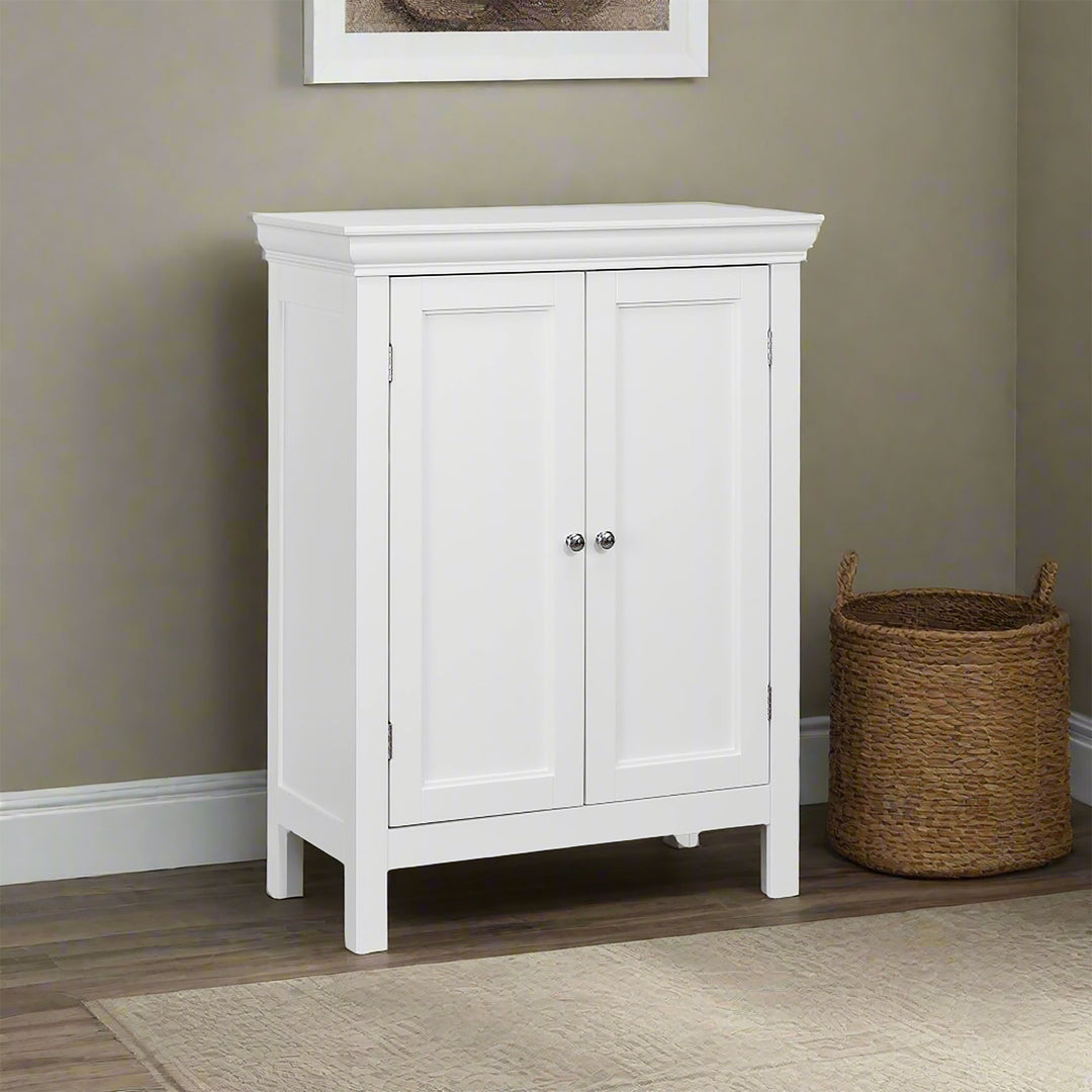 A white floor cabinet with double doors against a tan wall