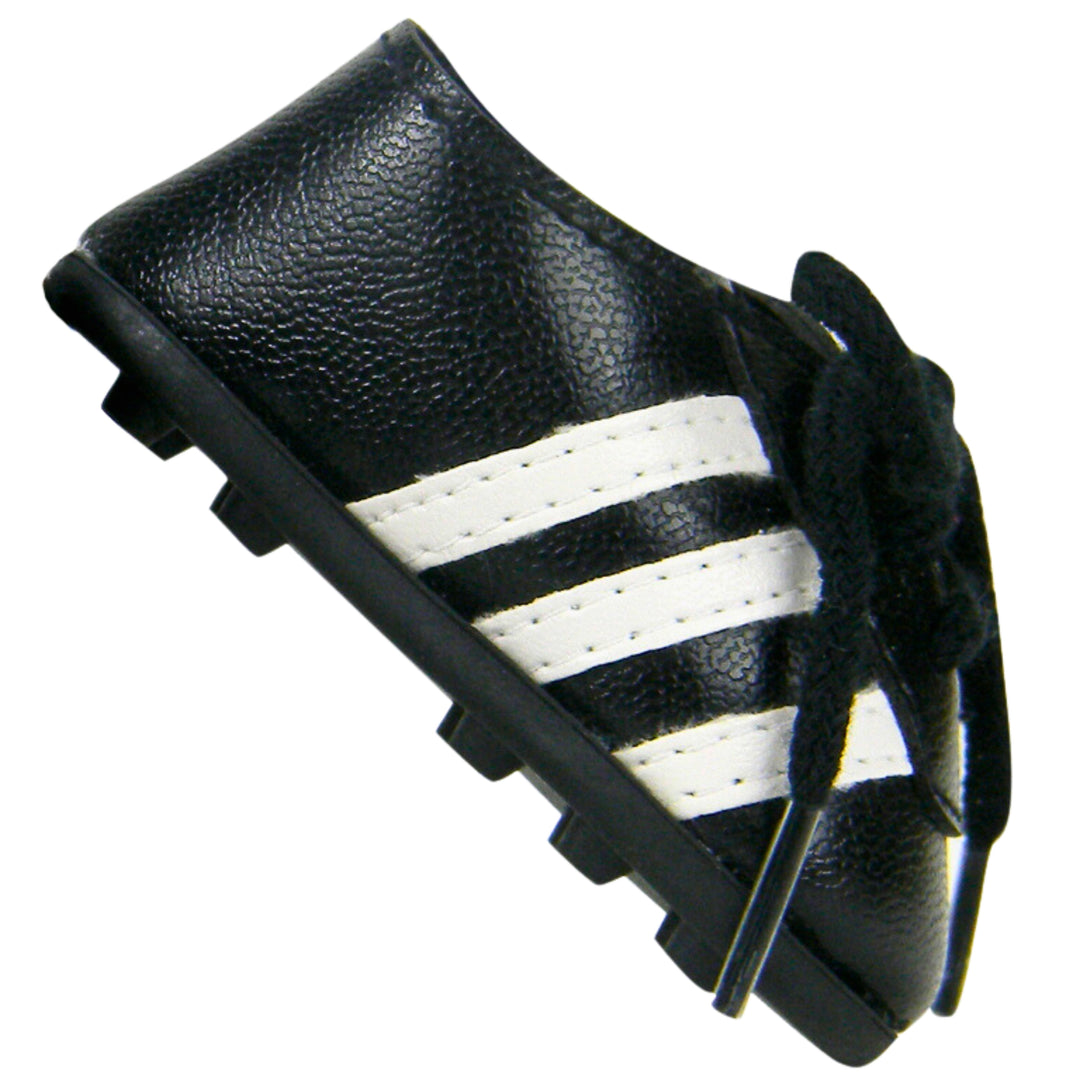 A close-up of a black soccer cleat with three white stripes for an 18" doll.