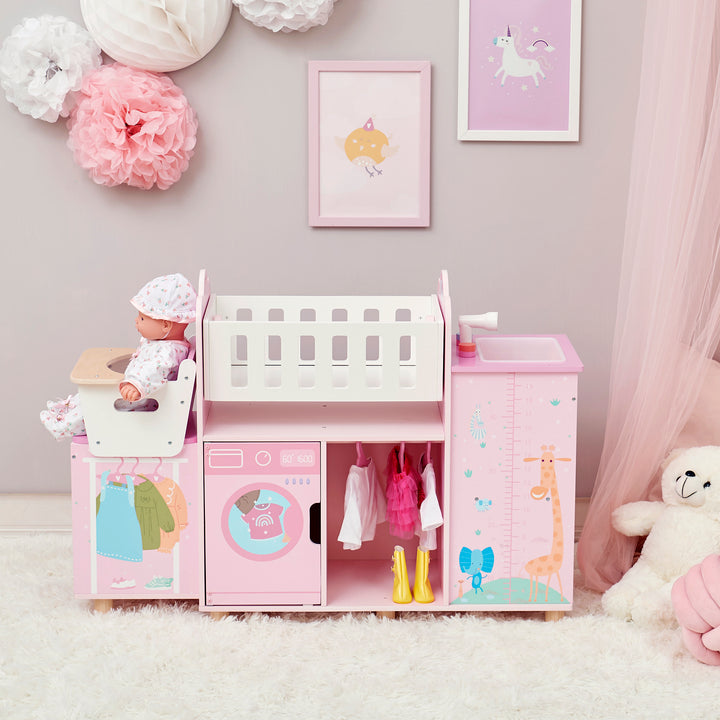 The  baby doll nursery station in pink with animal illustrations in a play room with pink sheers and a fluffy white rug.