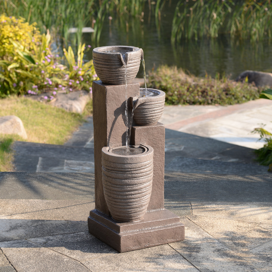 Horizontal Ribbed Pattern Outdoor Water Fountain with Warm Glow Lighting