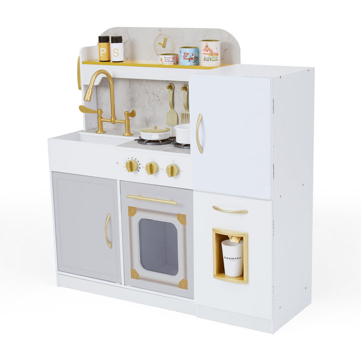 A white and gold child's play kitchen with a sink, stove and refrigerator