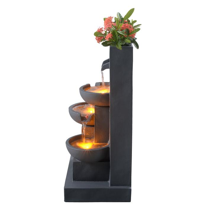 A view from the side of a Outdoor Water Fountain with Planter & LED Lights, Matte Gray, isolated on a white background.