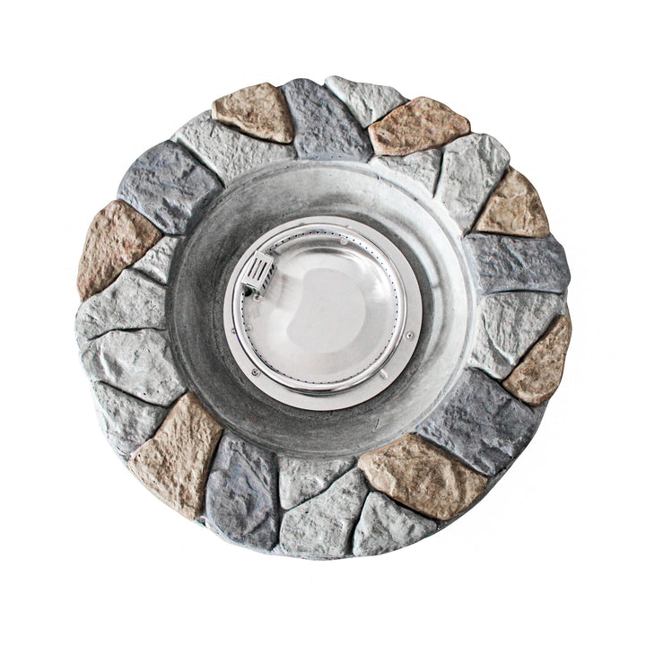 A view from above of the round stone propane gas fire pit with the fire ring and the rustic, textured surface