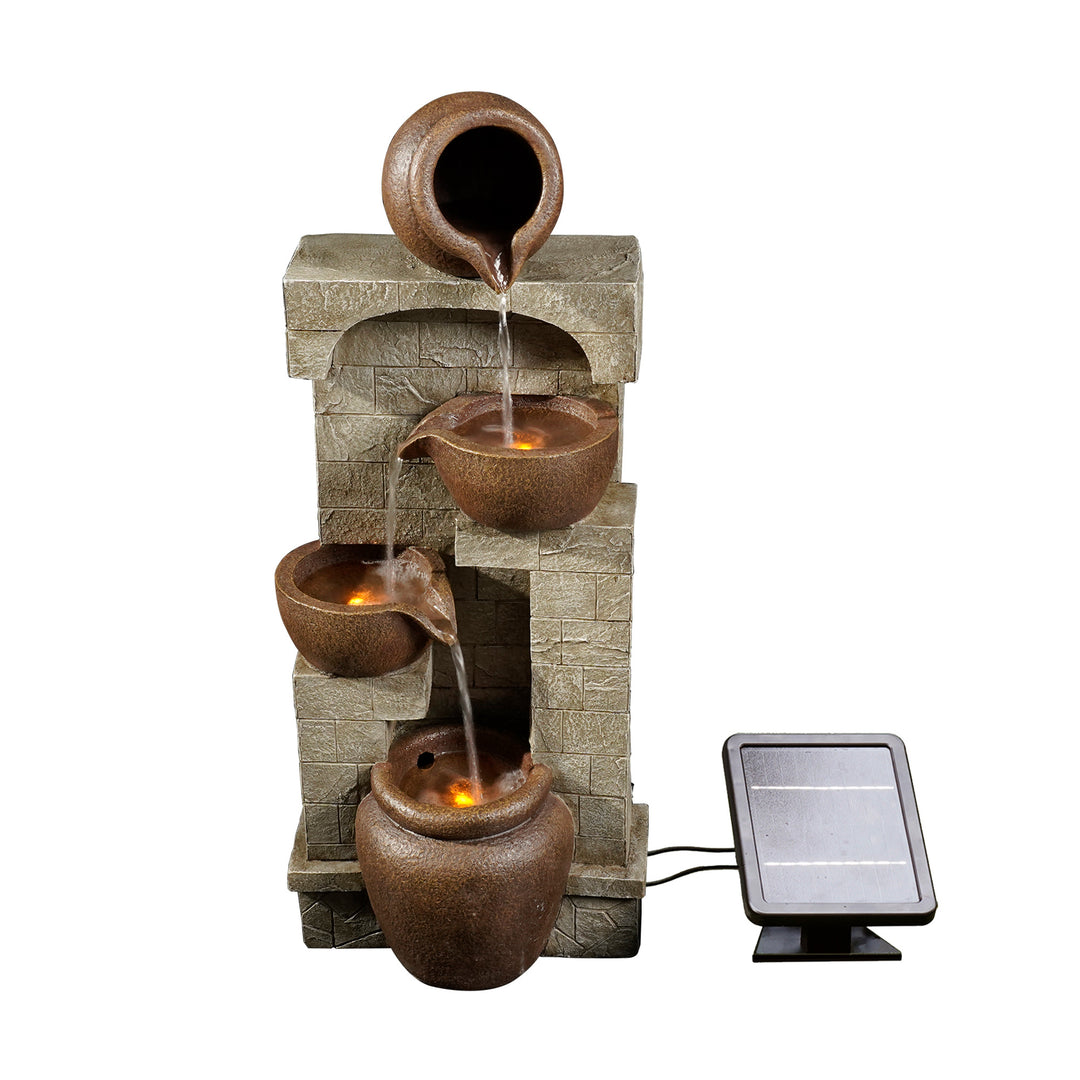 Water flowing and LED lights glowing in a Teamson Home 4-Tier Cascading Bowls Water Fountain with a solar panel, Brown.