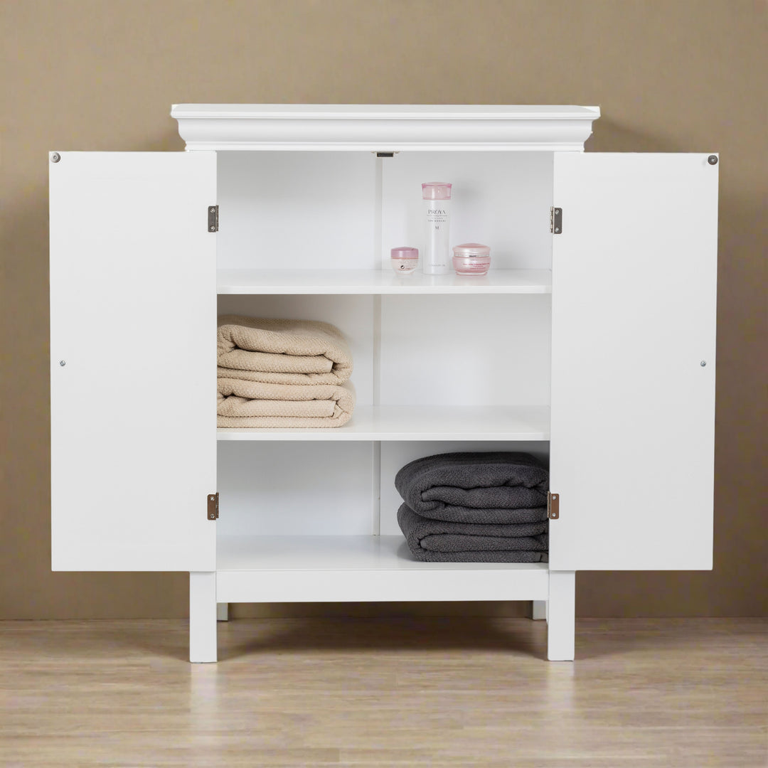 A white floor cabinet with doors open and bath items on each of the three shelves