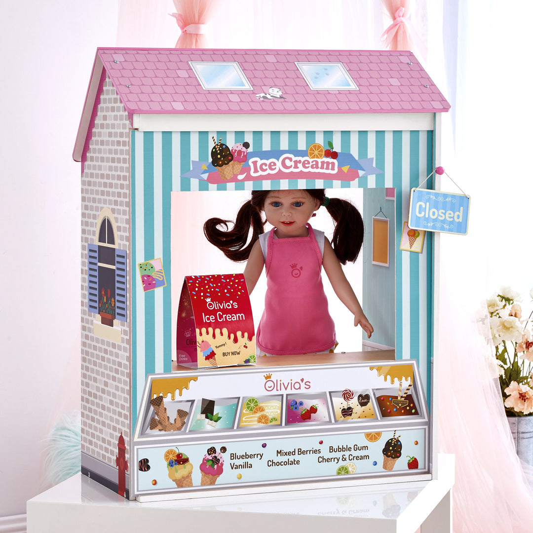 A 4-in-1 18" doll playset with the Ice Cream Shoppe facade with a closed sign, sandwich board and a brunette doll.