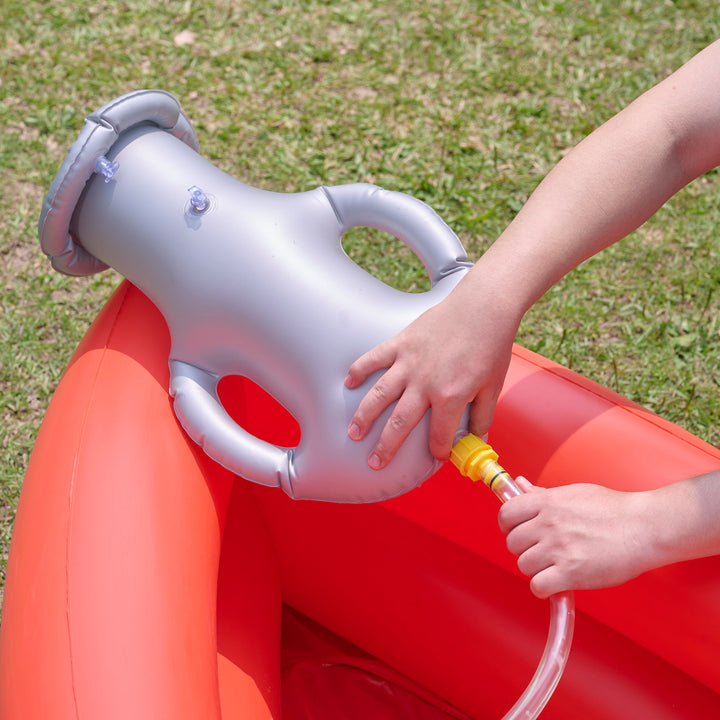 Inflating a Teamson Kids - Water Fun Pirate boat Inflatable Sprinkler Play with a manual air pump.