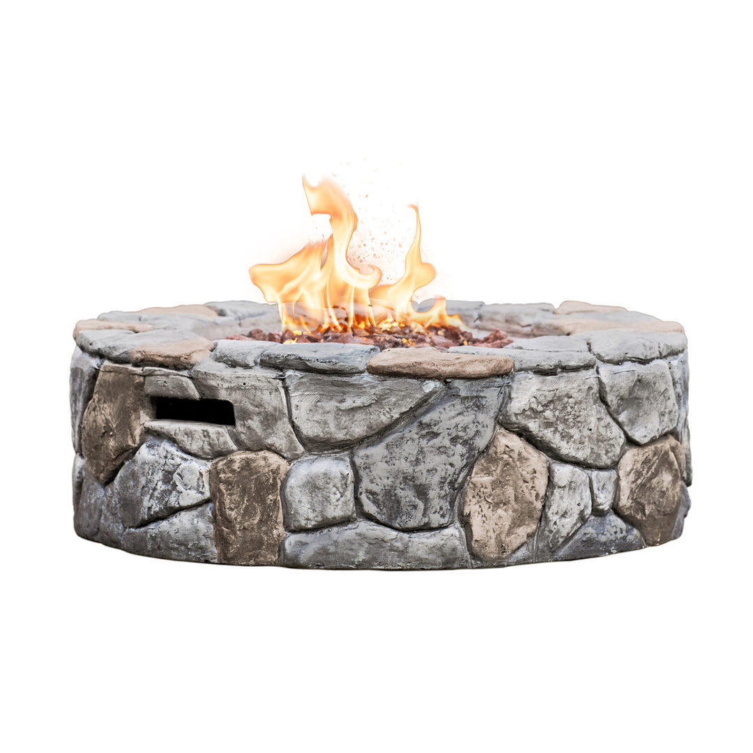 Teamson Home 28" Outdoor Round Stone Propane Gas Fire Pit, Stone Gray with flames, isolated on a white background.