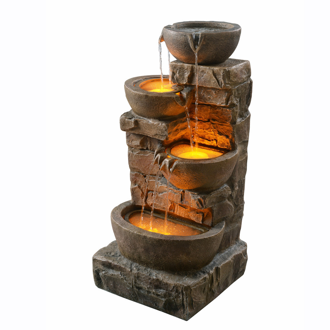 A view at an angle of the  33.27" Cascading Bowls & Stacked Stones LED Outdoor Fountain, Brown.