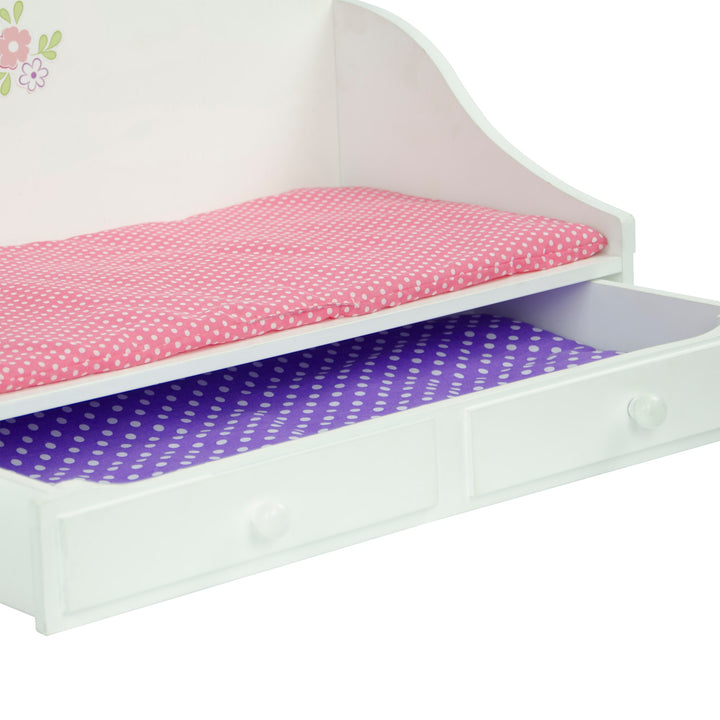 Close-up of the bed and the trundle drawer with a pink mattress and purple mattress.
